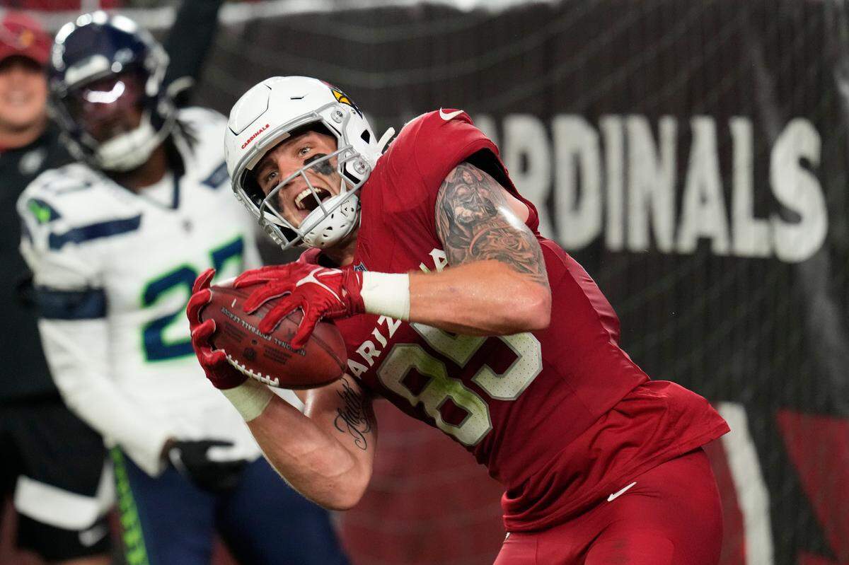 Arizona Cardinals tight end Trey McBride (85) celebrates after catching an 8-yard touchdown pass against the Seattle Seahawks in the second half of an NFL football game Sunday, Jan. 7, 2024, in Glendale, Ariz. (AP Photo/Ross D. Franklin)