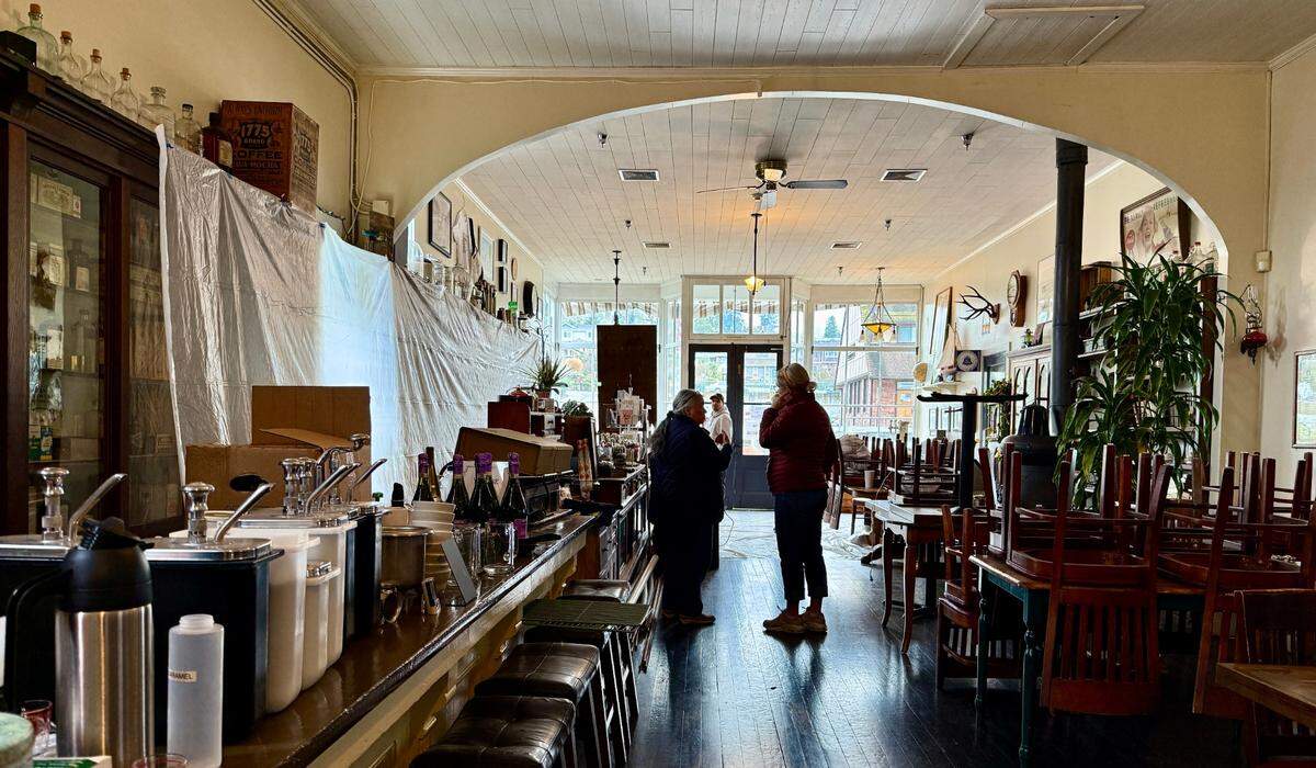 The Bair, a bistro and “living museum” in a historic landmark in Steilacoom, is closed temporarily while crews restore its early-20th-century soda fountain to “new but old” working condition. Restaurant owner Sara Reid (right) talks with Marianne Bull, curator of the Steilacoom Historical Museum Association, on Monday, Jan. 13, 2025.
