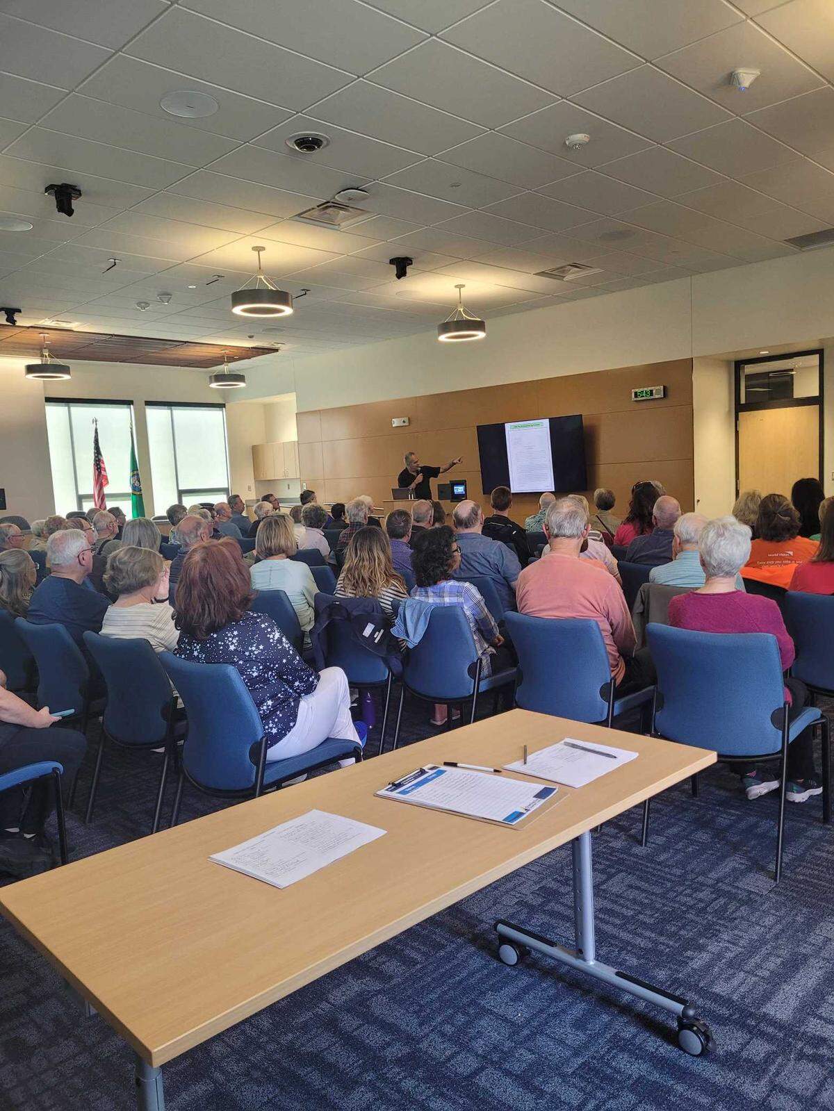 Jon Rose, the vice president of real estate for Raydient/Rayonier, talks to residents about the future and history of the Village at Harbor Hill project June 11, 2024 at Swift Water Elementary School in Gig Harbor.