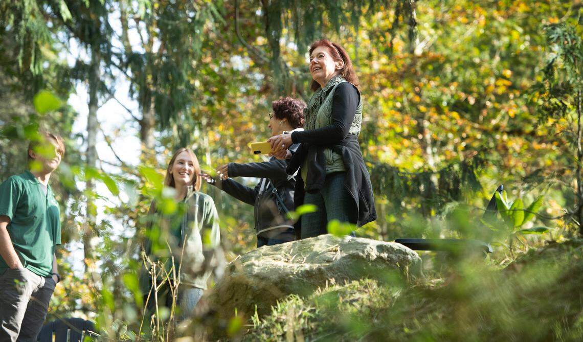 Lorna Moore takes in the view at the Earth Funeral forest site north of Quilcene, Washington, on Thursday, Oct. 3, 2024. Moore plans to have her remains composted and placed on the conservation land.
