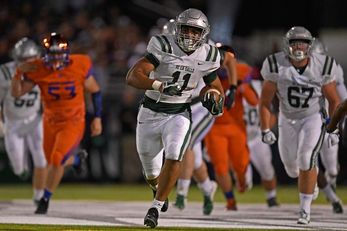 De La Salle’s Henry To’oto’o (11) runs for a touchdown against Bishop Gorman in the second quarter of their game at De La Salle High School in Concord, Calif., on Friday, Sept. 14, 2018. (Jose Carlos Fajardo/Bay Area News Group)