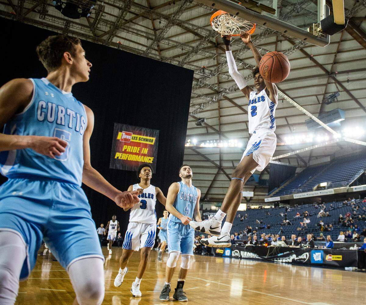 Federal Way’s Jaden McDaniels (2) throws down a dunk in the third quarter. Federal Way played Curtis in the 4A 3rd/5th place consolation game at the Hardwood Classic State Basketball Tournament at the Tacoma Dome in Tacoma, Wash., on Saturday, March 2, 2019.