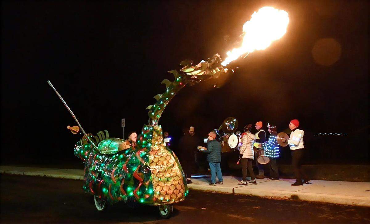Steve LaBerge’s flaming dragon lights up the night at Boze Elementary School in Tacoma, Washington, as part of the Tacoma Light Trail preview on Wednesday, Dec. 7, 2022.