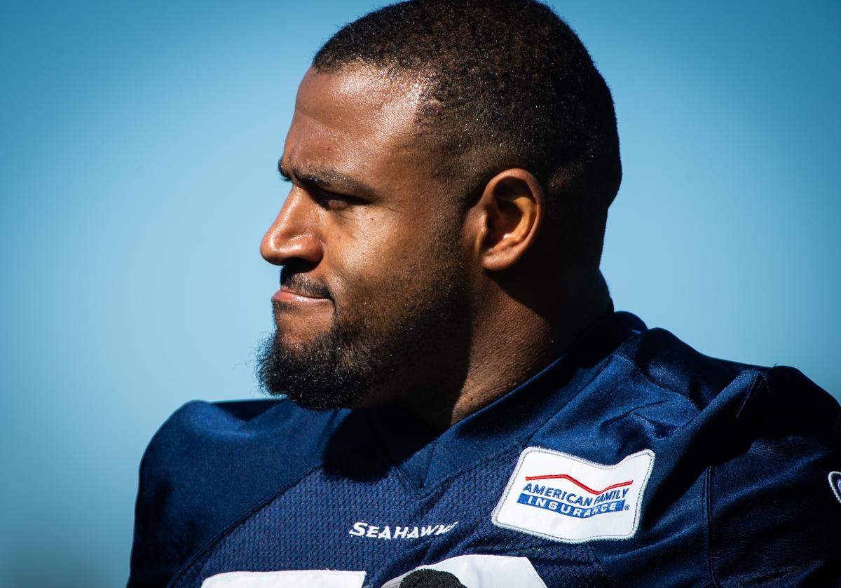 Duane Brown takes. Moment between drills at the Seattle Seahawks training camp at the Virginia Mason Athletic Center in Renton, Wash., on Thursday, July 25, 2019.