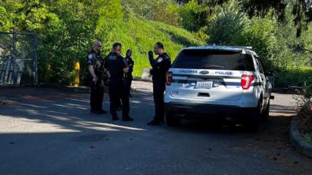Tacoma police at the scene of Tuesday’s arrest of a suspected car thief suspect who was fired upon by an armed citizen.