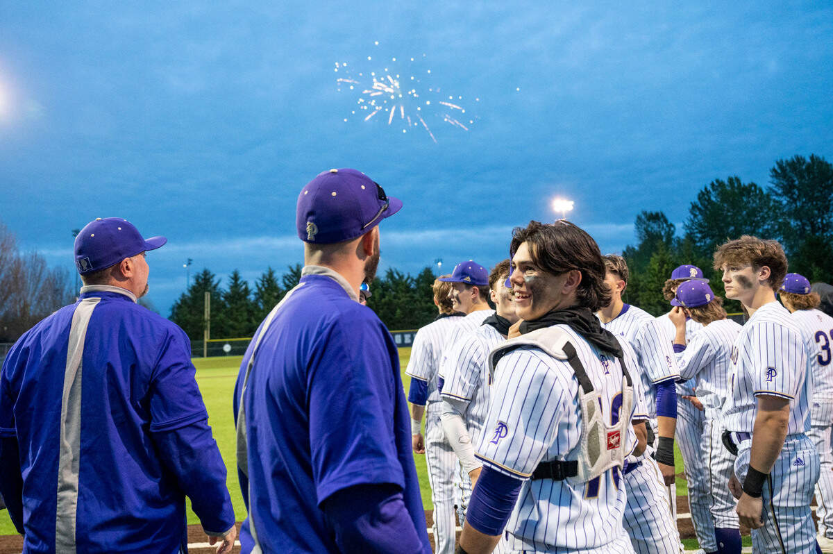 A small fireworks show was put together to celebrate Puyallup head coach Marc Wiese’s (left) 500th win on Tuesday, May 3, 2022, at Heritage Park in Puyallup.