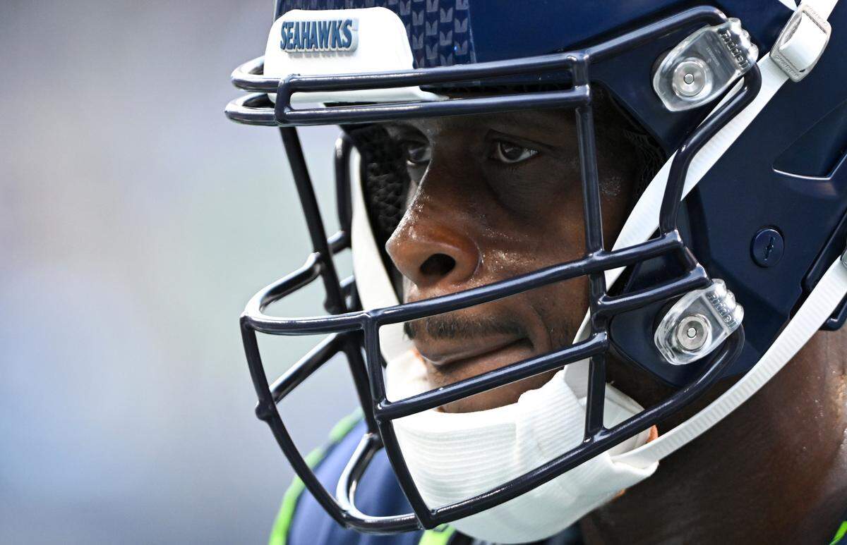 Seattle Seahawks quarterback Geno Smith (7) focuses before the preseason game against the Dallas Cowboys at Lumen Field, Saturday, Aug. 19, 2023, in Seattle, Wash.