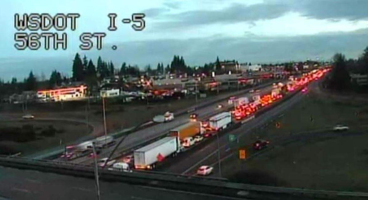 Both directions of Interstate 5 were blocked and backed up early Tuesday after a semi jackknifed and crashed into a barrier.