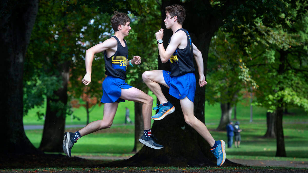 Stadium senior cross country runners Jacob (left) and Luke Alfonso are leading the Tigers with times among the state’s fastest Top 20. The fraternal twins are shown before a cross county meet at Wright Park in Tacoma, Washington, on Wednesday, Oct. 6, 2021.