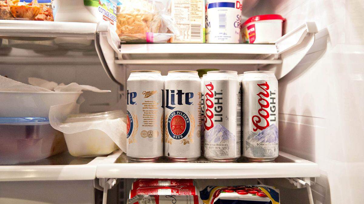 Cans of Molson Coors Brewing Miller Lite and Coors Light brand beer are arranged for a photograph in a refrigerator in Princeton, Illinois, on Oct. 26, 2016. MUST CREDIT: Daniel Acker/Bloomberg