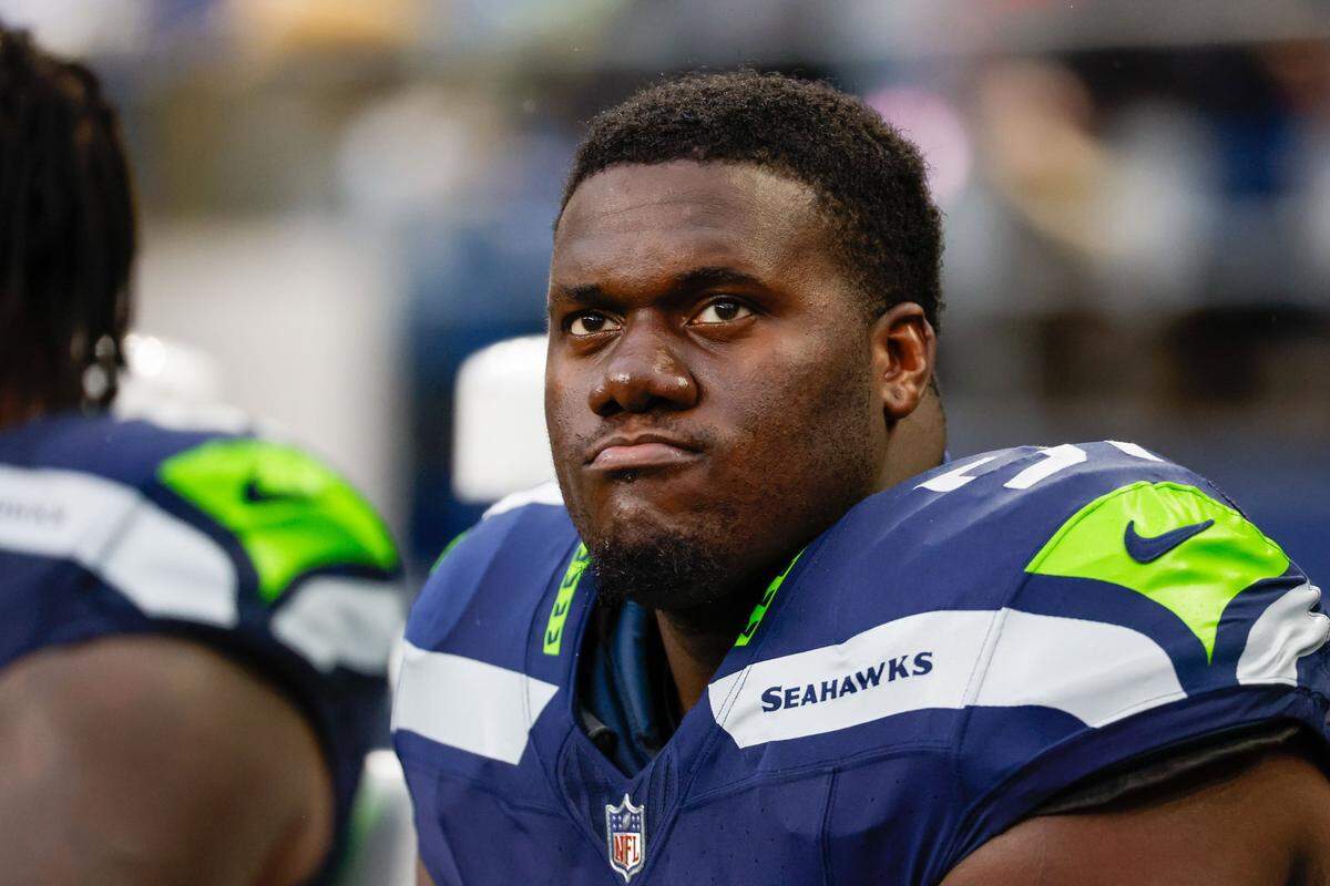 Nov 12, 2023; Seattle, Washington, USA; Seattle Seahawks center Olu Oluwatimi (51) sits on the sideline during the third quarter against the Washington Commanders at Lumen Field. Mandatory Credit: Joe Nicholson-USA TODAY Sports