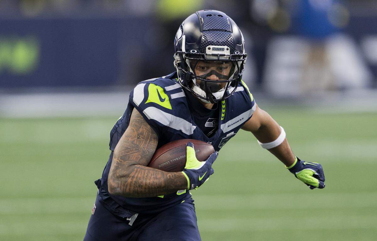 Seattle Seahawks wide receiver Jaxon Smith-Njigba (11) runs after a 11-yard reception during the fourth quarter of the game against the Arizona Cardinals at Lumen Field, on Sunday, Nov. 9, 2025, in Seattle.
