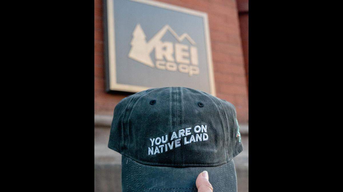 Indigenous-owned brand Urban Native Era has partnered with REI for its first major retail launch starting with its everyday cap and beanie featuring their popular “You are on Native land” design at 40 select REI stores nation-wide beginning Saturday, Jan. 8, 2022. In Washington, the items will available at the Bellingham and Seattle locations, but are also available online and for in-store pickup at all REI locations.