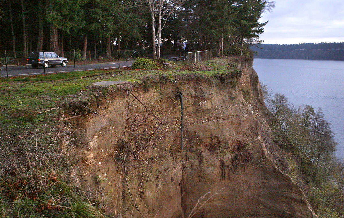 Significant erosion on the bluffs at the Gig Harbor Viewpoint may require moving Five Mile Drive farther back into Point Defiance Park. This photo showing the erosion is from 2007 in Tacoma. (Drew Perine/The News Tribune)