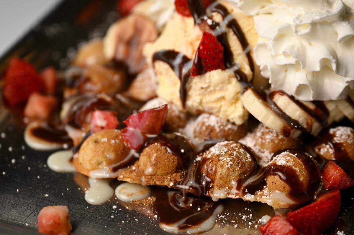 Puffles are another unusual sweet treat at Let It Snow. The Shorty Special is sprinkled with cinnamon and powdered sugar, drizzled with Nutella and condensed milk, then finished with strawberries and bananas.