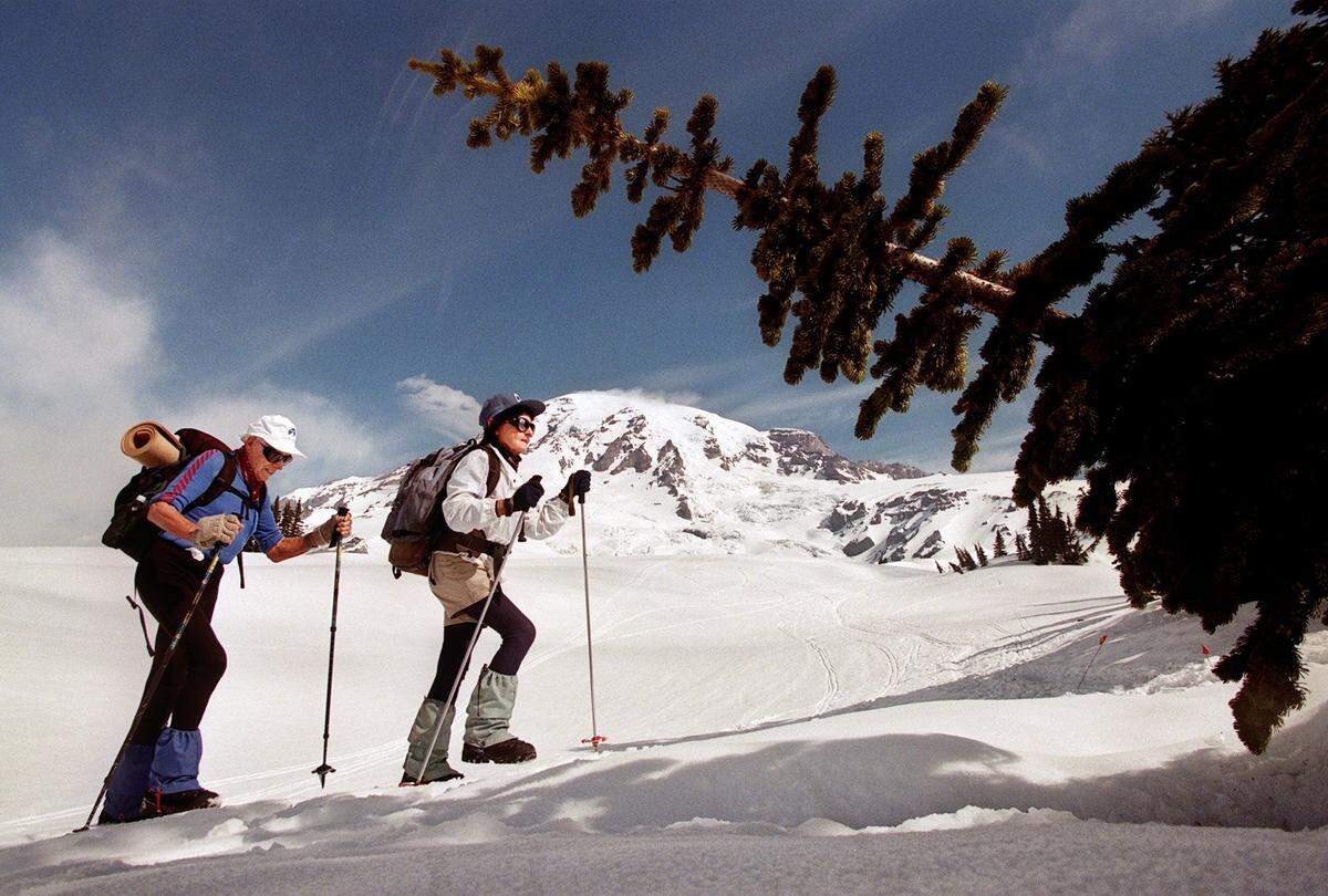 On the trail or snow, Ake and Bronka Sundstrom served as an inspiration to hikers of all ages. Here they enjoy the view of the summit of Mount Rainier on their way to Panorama Point and beyond in 1999.