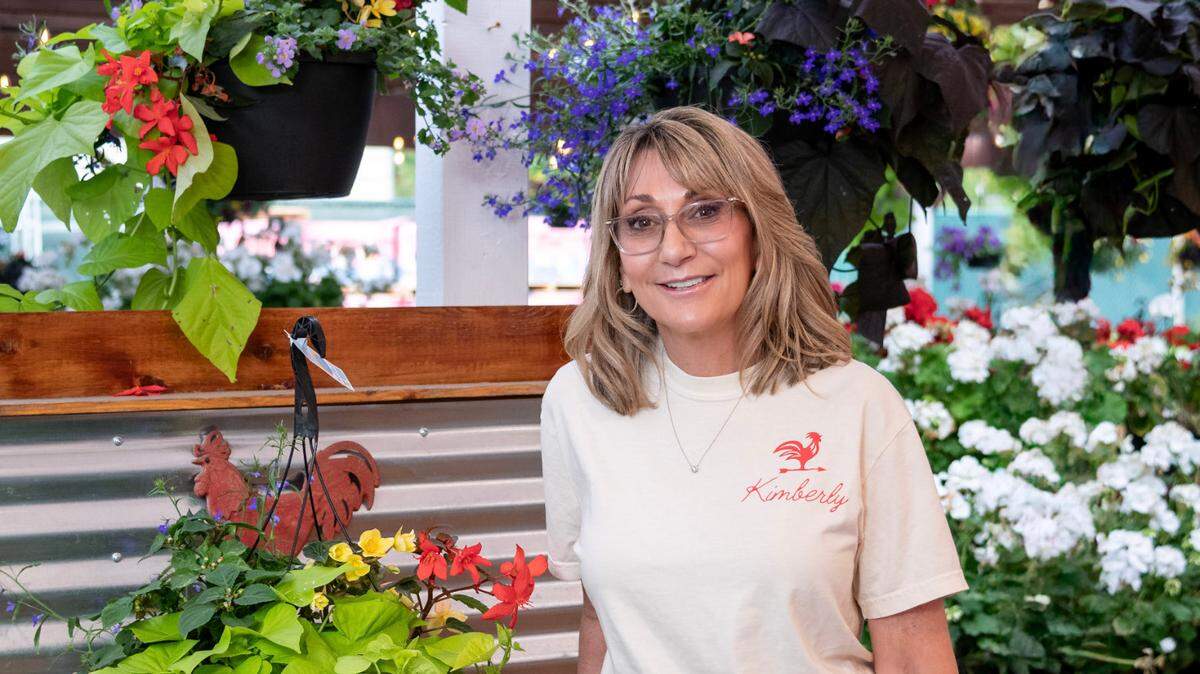 Kimberly Charlton, the new owner of Red Barn Market & Nursery, poses at the business on June 14, 2025.