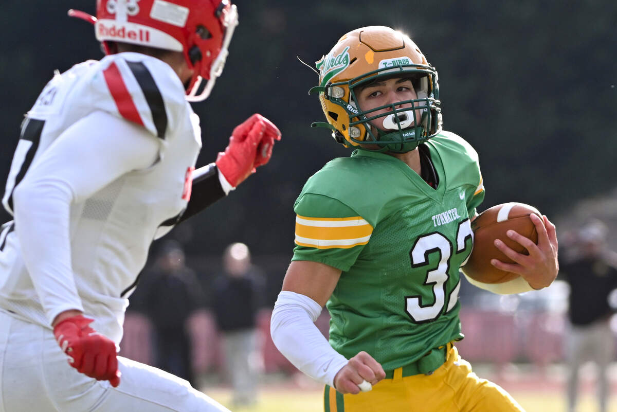 Tumwater’s Peyton Davis (32) rushes to within inches of the end zone against Clarkston’s Mason Brown (7) during the first half of the 2A state quarterfinals at Tumwater District Stadium, Saturday, Nov. 18, 2023, in Tumwater, Wash.