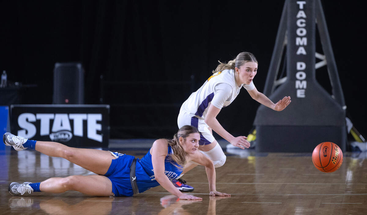Sumner’s Madison Hughes forces a turnover from Bothell’s Makenzie Kooy during the Spartan’s 15-point comeback in Thursday morning’s 4A girls state basketball quarterfinal game in the TacomaDome in Tacoma, Washington, on Thursday, Feb. 29, 2024. After trailing by as many as 15 points at multiple time in the game, Sumner rallied to tie the game in the fourth quarter, then won the game in overtime, 54-52.