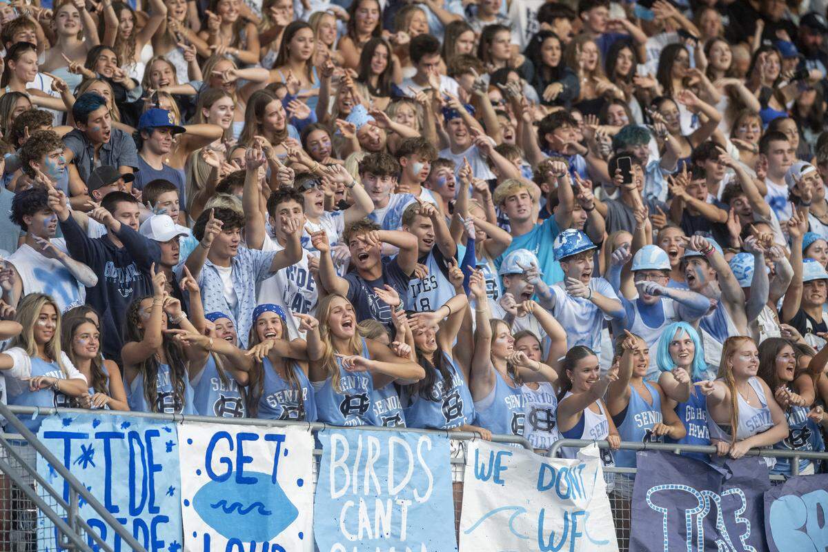 Gig Harbor fans take part in a roller coaster cheer from the student section as they take on Peninsula in the Fish Bowl on Saturday, Sept. 6, 2025, at Mount Tahoma Stadium in Tacoma, Wash.