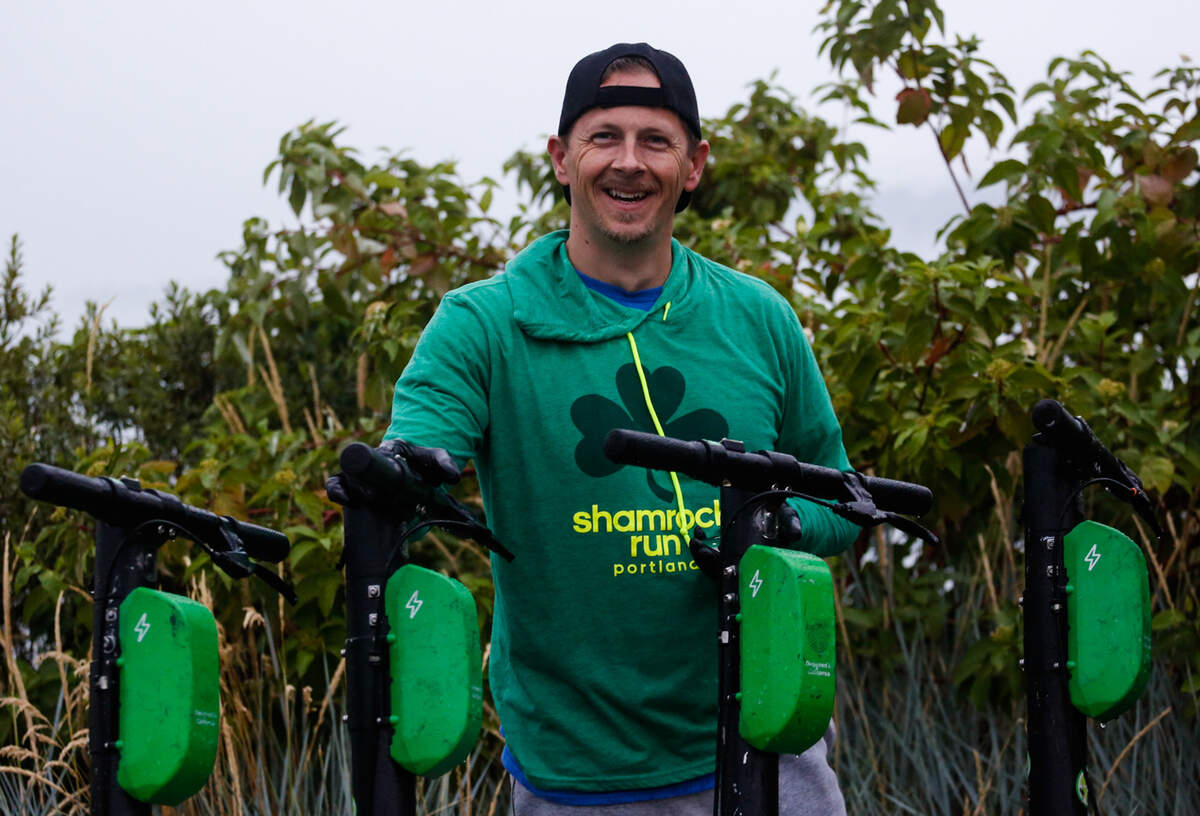 Lime scooter charger Shon Smith poses for a photo near the dock at Old Town Aug. 10, 2019. Smith recently moved to Tacoma from Arizona.