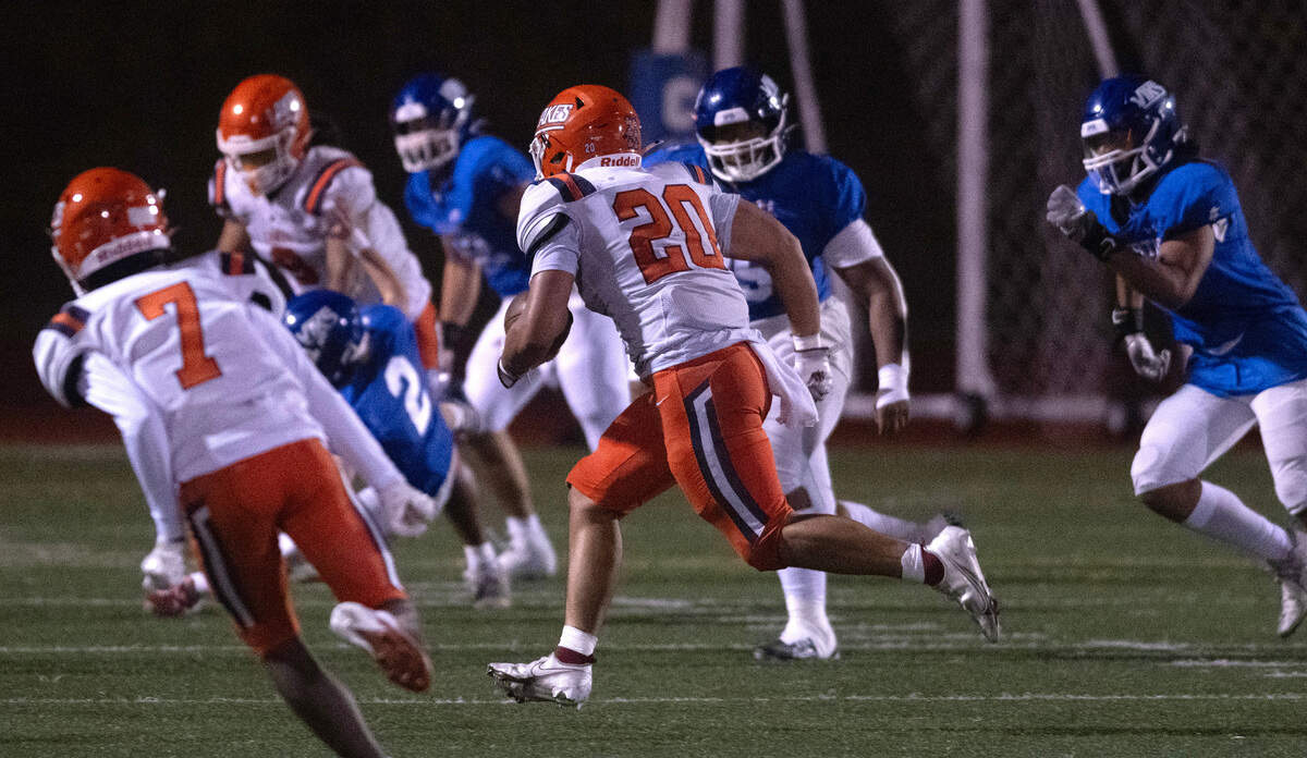 Lakes’ Michael Pulalasi (20) returns an intercepton during Friday night’s football game at Viking Stadium in University Place, Washington, on Sept. 20, 2024. After trailing 10-0, Lakes won the game, 14-10.