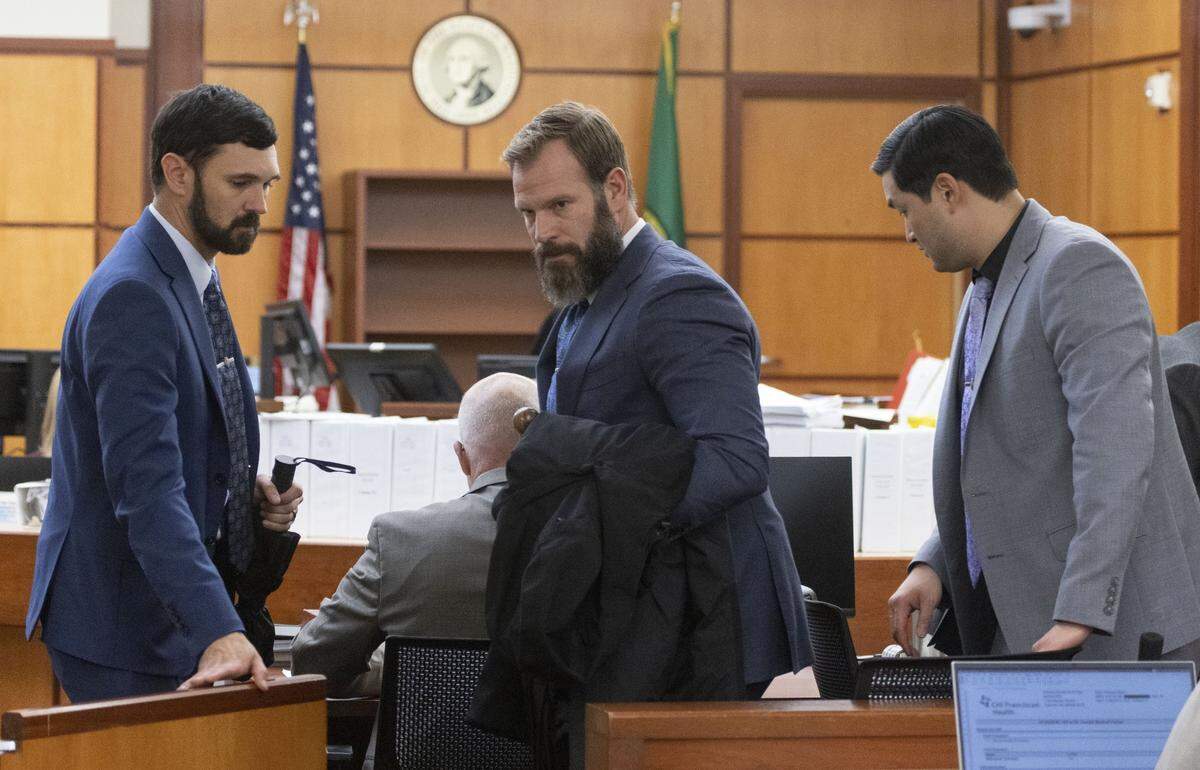 From left to right, Christopher Burbank, Matthew Collins and Timothy Rankine head out of court Wednesday. The jury has gone home and will be back in court Monday for closing arguments.