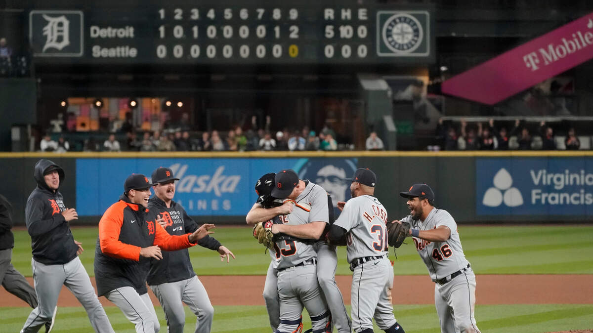 Detroit Tigers starting pitcher Spencer Turnbull, center right, hugs catcher Eric Haase as teammates rush in after Turnbull threw a no-hitter against the Seattle Mariners in a baseball game Tuesday, May 18, 2021, in Seattle. The Tigers won 5-0. (AP Photo/Ted S. Warren)