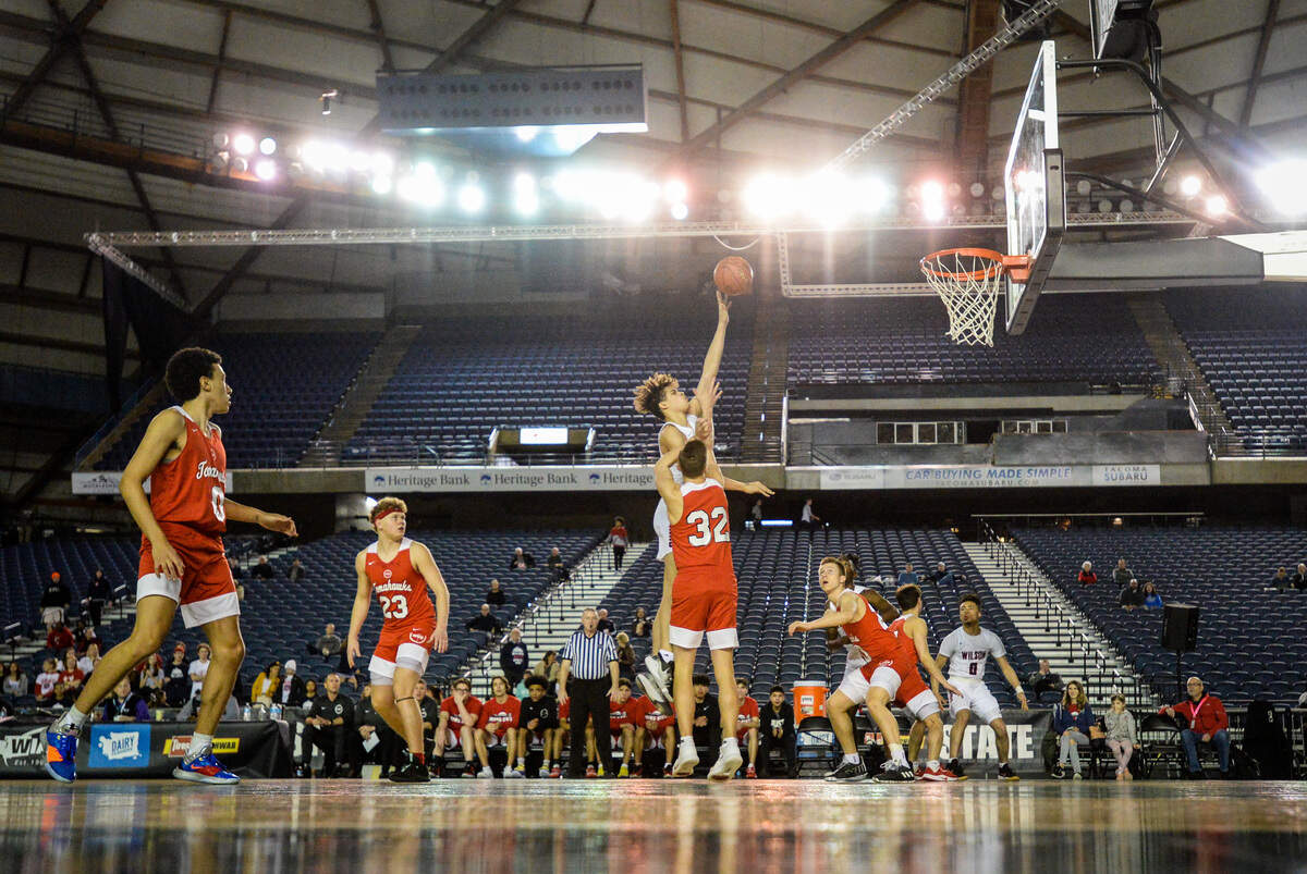 Wilson’s Jackson Dorsey puts up a shot during the first quarter. Wilson played Marysville-Pilchuck in a basketball game at Hardwood Classic at the Tacoma Dome in Tacoma, Wash., on Friday, March 6, 2020.