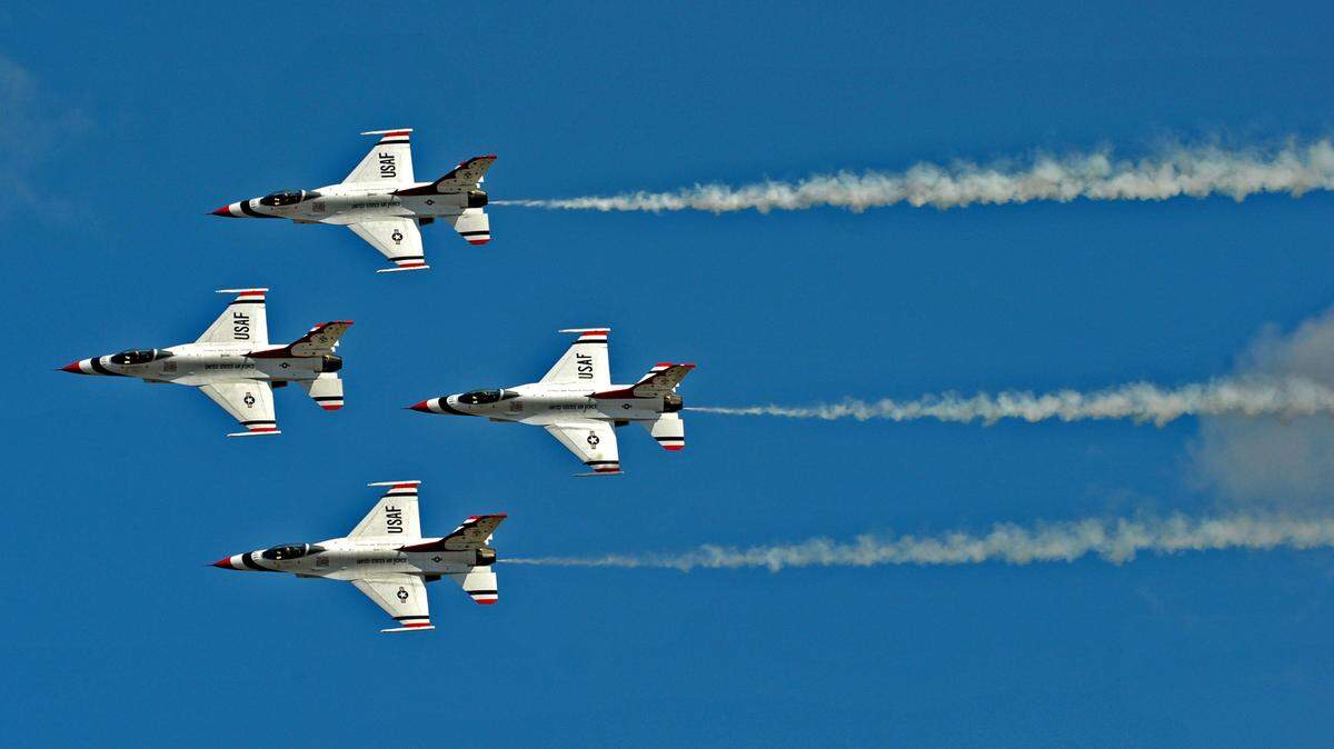 Members from the U.S. Air Force Thunderbirds perform at the Air Expo 2012 at Joint Base Lewis-McChord on July 21, 2012. The air show and expo are returning to JBLM this summer after a seven-year absence.