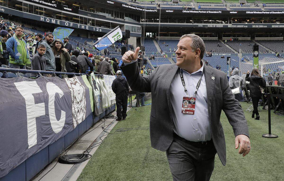 Seattle Sounders general manager Garth Lagerwey gestures to fans after the Sounders beat Toronto FC 3-2 in an MLS soccer match, Saturday, April 13, 2019, in Seattle.
