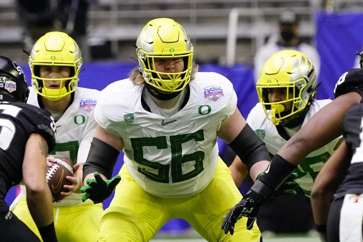 Oregon offensive lineman T.J. Bass (56) during the first half of the Fiesta Bowl NCAA college football game against Iowa State, Saturday, Jan. 2, 2021, in Glendale, Ariz. (AP Photo/Rick Scuteri)