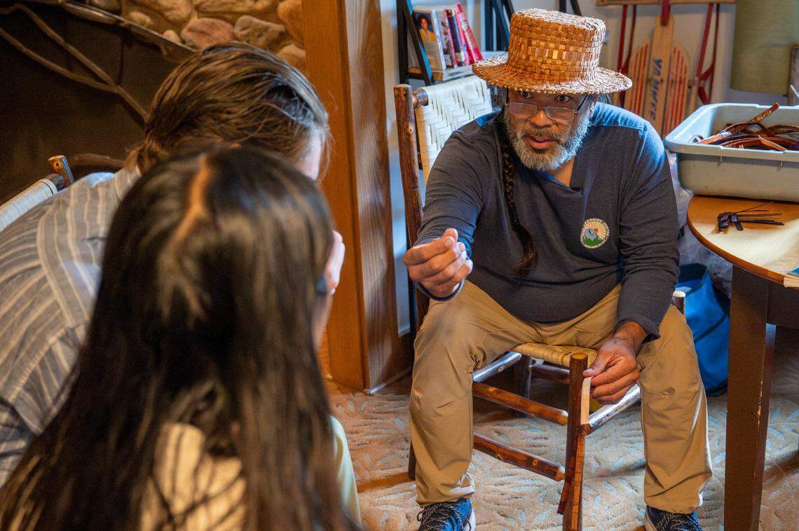 Hweqwidi Hanford McCloud, right, a Nisqually tribal member and a liaison for the Nisqually Tribal Council, shares his insights as a master weaver with guests of the National Park Inn on Friday, June 6, 2025, at Mount Rainier National Park.
