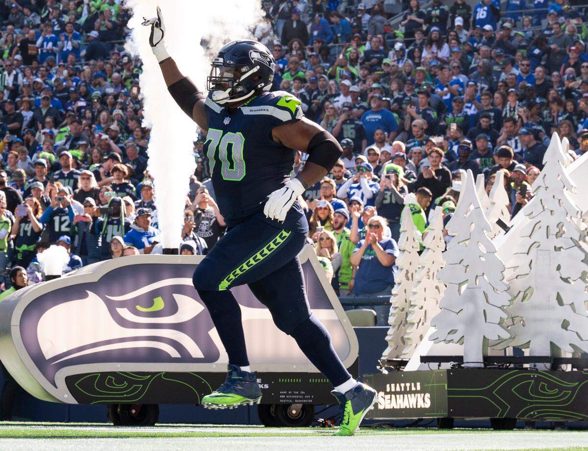 Seattle Seahawks guard Laken Tomlinson (70) runs out on the field before the game against the New York Giants at Lumen Field, on Sunday, Oct. 6, 2024 in Seattle, Wash.
