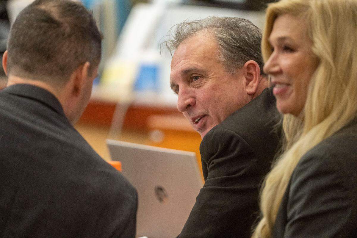 Flanked by his defense attorneys, Pierce County Sheriff Ed Troyer, in between witness testimony on Monday, Dec. 5, 2022, in Pierce County District Court in Tacoma.