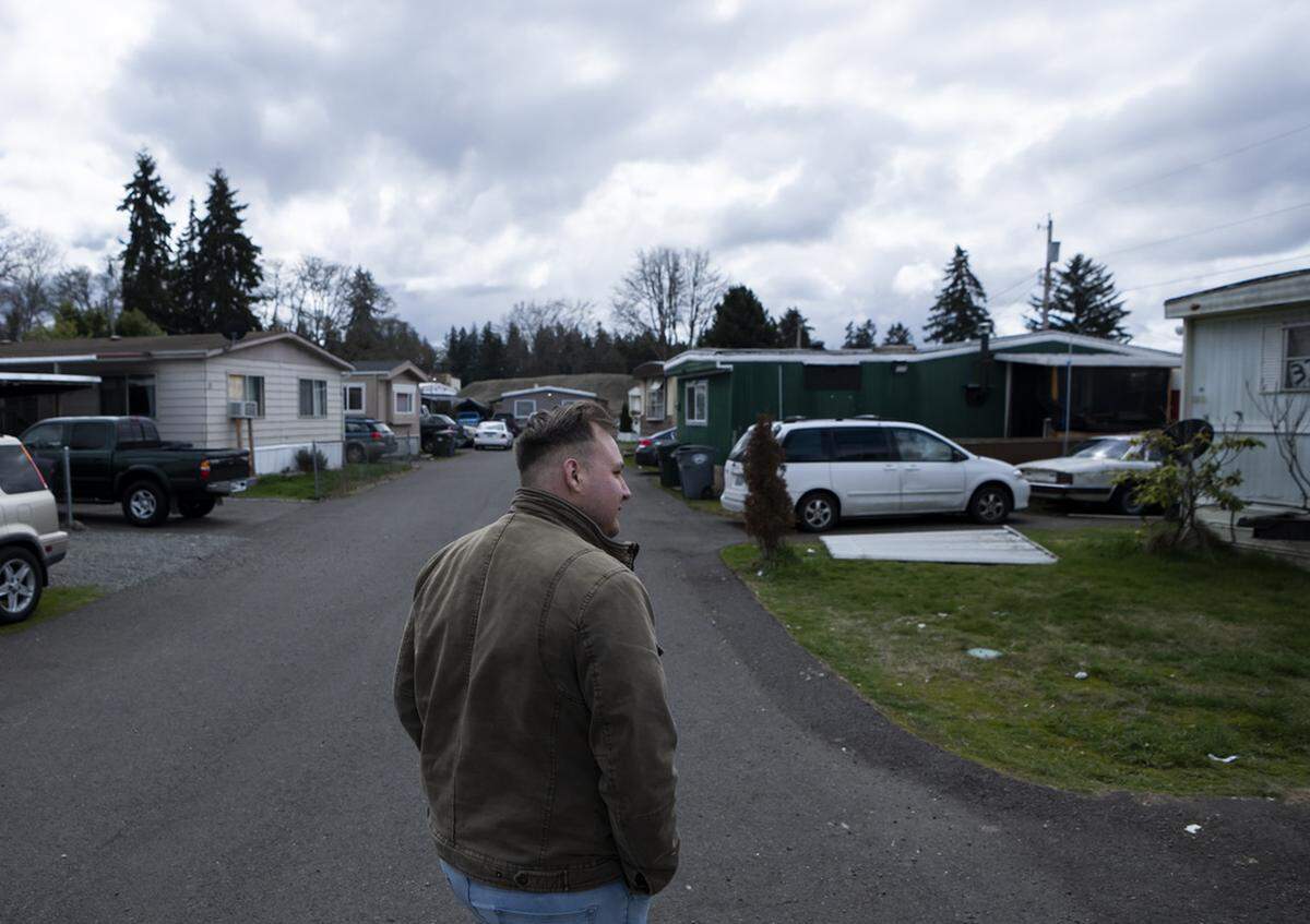 Resident and board member of the mobile home park Bob’s and Jamestown Homeowners Cooperative, Gadiel Galvez, 22, takes a walk in his neighborhood on Saturday, March 25, 2023, in Lakewood. When residents learned the park’s owner was looking to sell, they formed a cooperative and bought it themselves amid worries it would be redeveloped. A brush fire Friday, Aug. 4, 2023, destroyed at least five homes in the park.