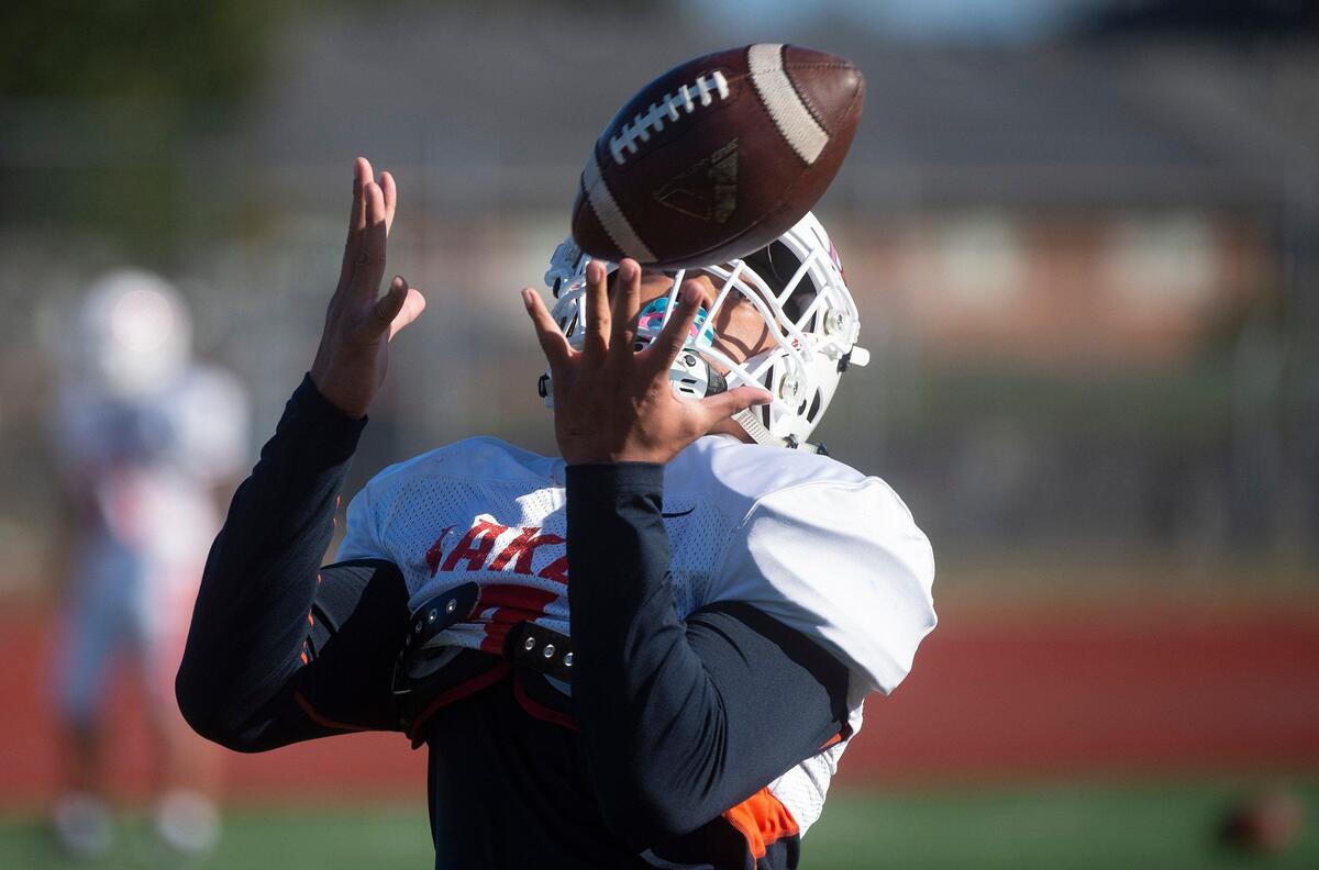 Lakes sophomore Devon Nofoa-Masoe pulls in a pass during football practice at Lake High School in Lakewood on Oct. 1, 2019.