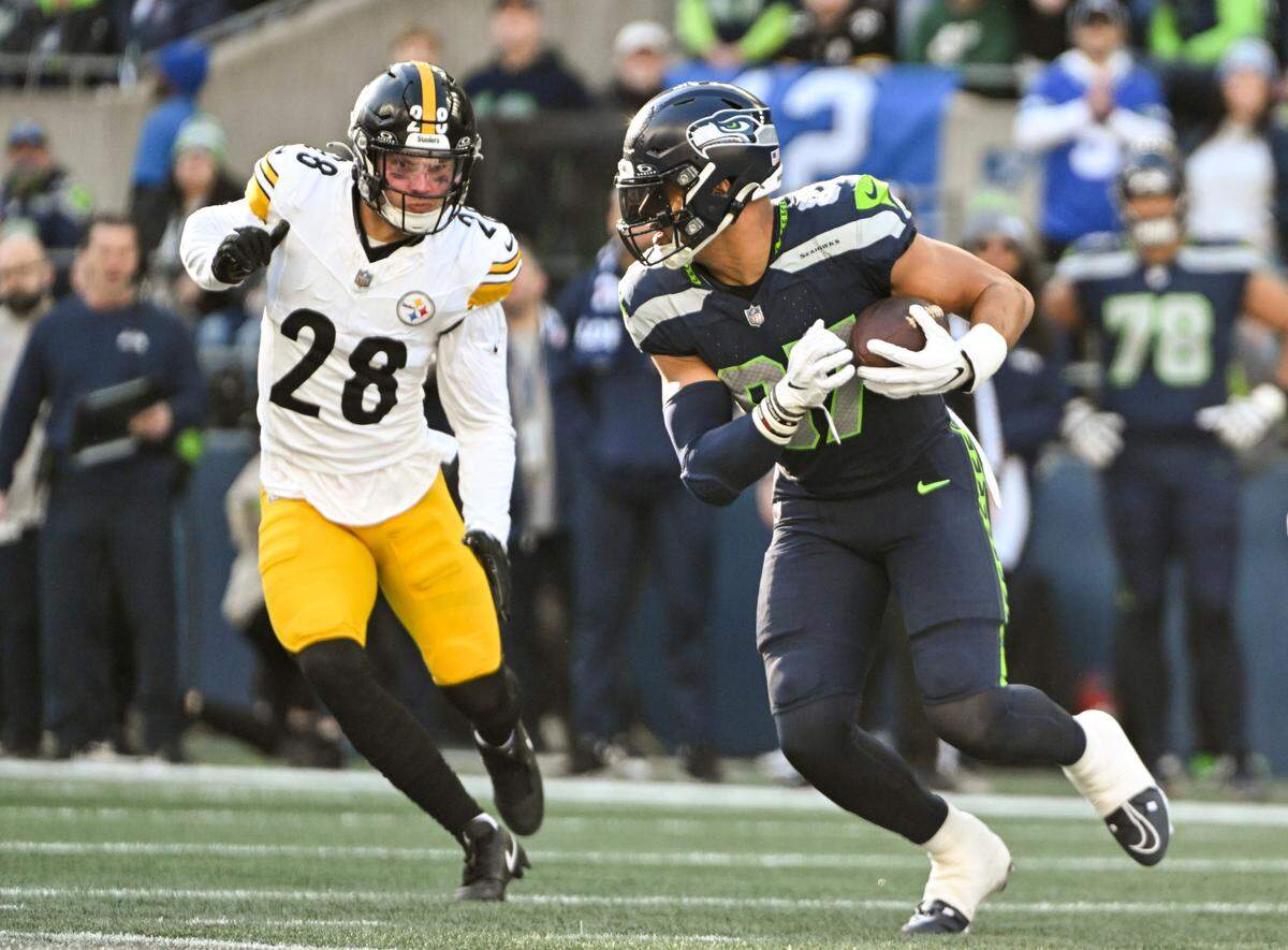 Seattle Seahawks tight end Noah Fant (87) picks up yards after the catch during the first quarter of the game against the Pittsburgh Steelers at Lumen Field, on Sunday, Dec. 31, 2023, in Seattle, Wash.