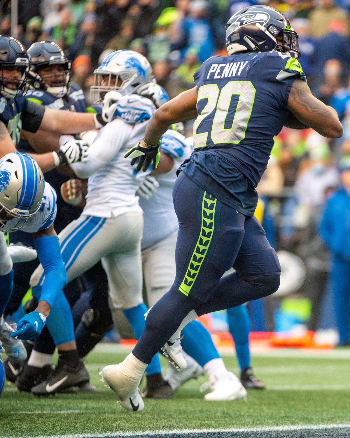 Seattle Seahawks running back Rashaad Penny (20) hops into the endzone for a rushing touchdown in the second quarter of an NFL game on Sunday, Jan. 2, 2022, at Lumen Field in Seattle.