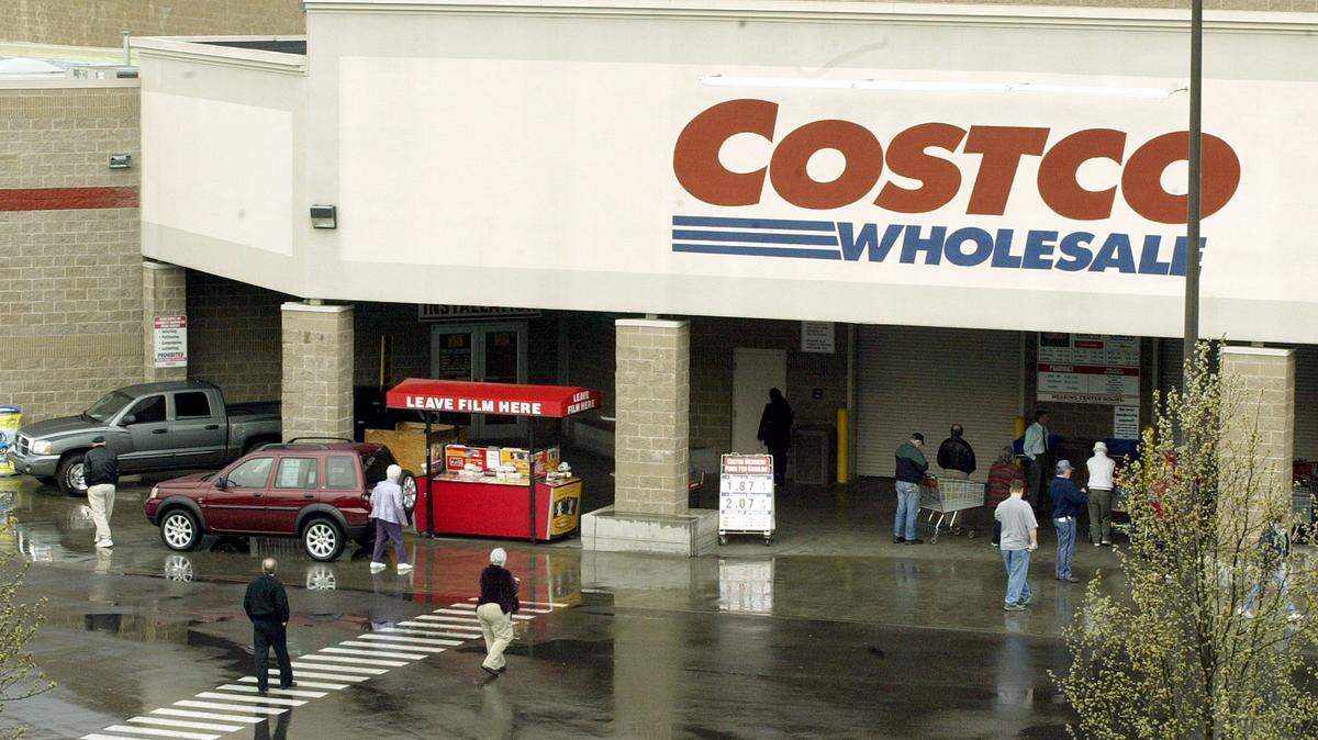 Shoppers enter the Tacoma Costco in this file photo. A longtime employee of the chain at its Fife warehouse pleaded guilty Wednesday to wire fraud in U.S. District Court in Tacoma for defrauding the company of nearly $300,000.