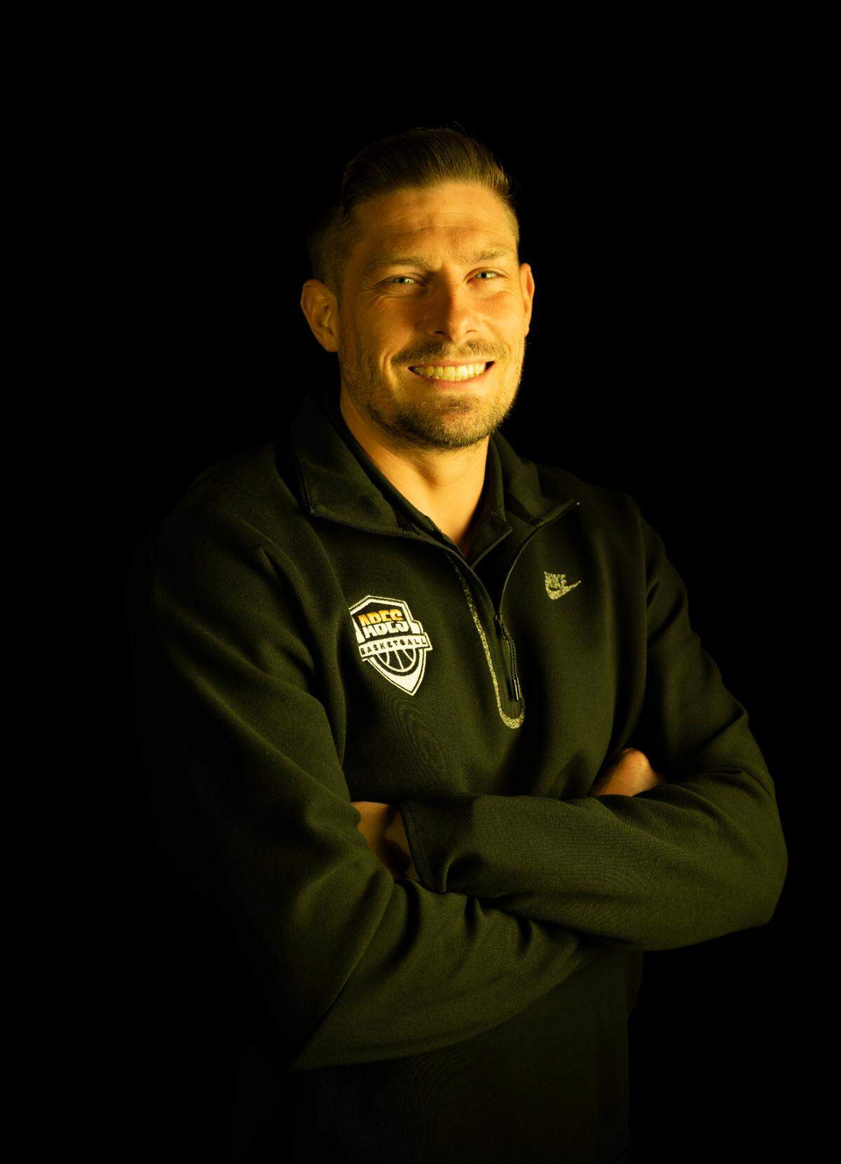 Lincoln head coach Ryan Rogers poses for a portrait after being selected as The News Tribune’s 2024 All-Area basketball coach of the year, at Silas High School, on Sunday, March 17, 2024 in Tacoma, Wash.