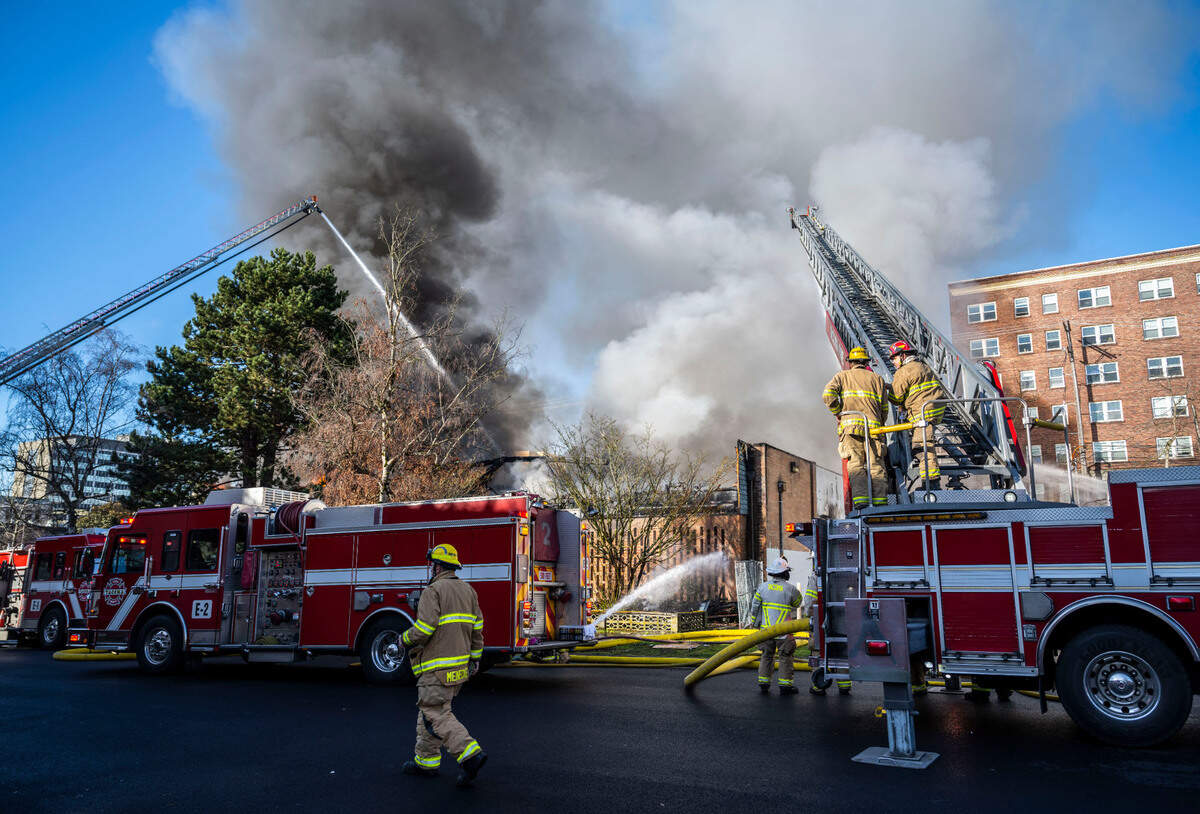 Tacoma firefighters battle a large commercial building fire in the 700 block of Fawcett Avenue in Tacoma on March 21, 2023. Tacoma Fire Department spokesperson Joe Meinecke said no injuries have been reported, but crews aren’t sure whether anyone was inside when the fire started. He said the building is supposed to be vacant.