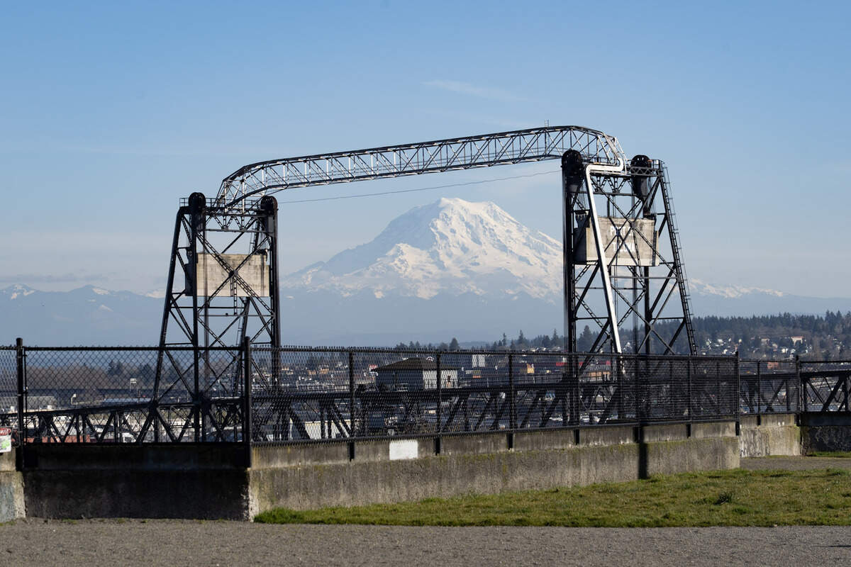Mount Rainier is framed by the Murray Morgan Bridge at Fireman’s Park in Tacoma.
