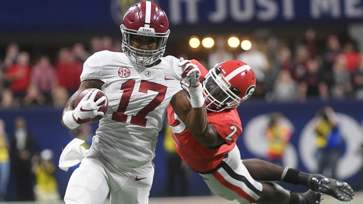 Georgia defensive back Richard LeCounte (2) misses the tackle on Alabama wide receiver Jaylen Waddle (17) during the second half of the Southeastern Conference championship NCAA college football game, Saturday, Dec. 1, 2018, in Atlanta. Waddle scored a touchdown on the play. (AP Photo/John Amis)