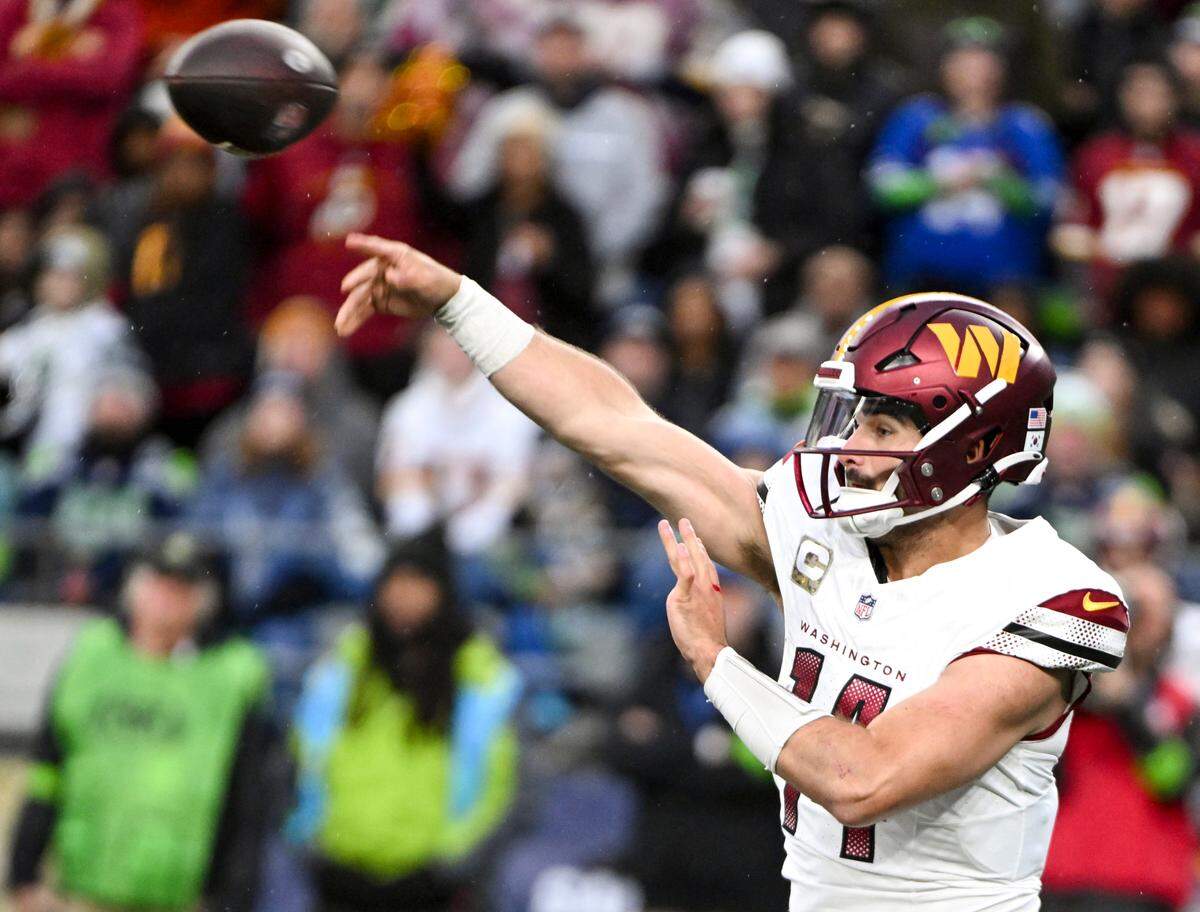 Washington Commanders quarterback Sam Howell (14) passes the ball during the third quarter of the game against the Seattle Seahawks at Lumen Field, on Sunday, Nov. 12, 2023, in Seattle, Wash.