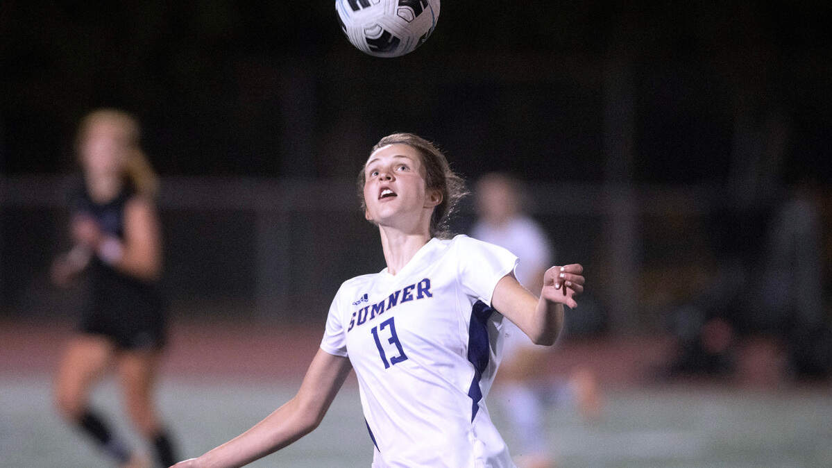 Sumner midfielder Sara Zehnder heads the ball during Monday night’s girls soccer game against the Curtis Vikings at Viking Stadium in University Place, Washington, on Oct. 9, 2023. Curtis won the game, 3-2.