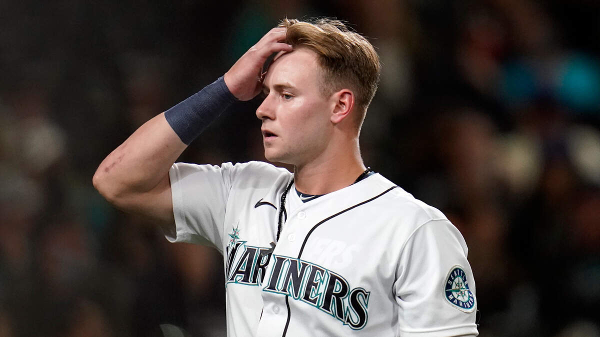 Seattle Mariners’ Jarred Kelenic walks away from the plate after striking out looking against the Arizona Diamondbacks to end the sixth inning of a baseball game Saturday, Sept. 11, 2021, in Seattle. (AP Photo/Elaine Thompson)