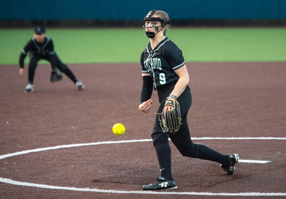 Kentwood pitcher Sarah Wright (9) pitches during the third inning of a non-conference varsity softball game against Auburn Riverside at Auburn Riverside High School in Auburn, Wash. on April 25, 2023. Kentwood defeated Auburn Riverside 3-0.