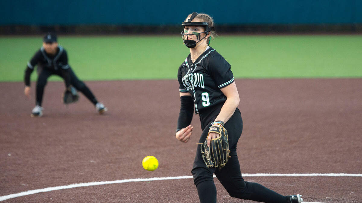 Kentwood pitcher Sarah Wright (9) pitches during the third inning of a non-conference varsity softball game against Auburn Riverside at Auburn Riverside High School in Auburn, Wash. on April 25, 2023. Kentwood defeated Auburn Riverside 3-0.