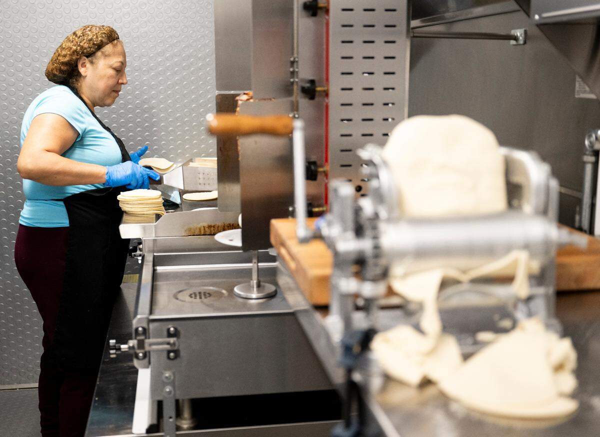 Lemus joined Mendiola when Tacos Mirrey opened in October 2022. She is often at the grill, cooking fresh tortillas and meat.